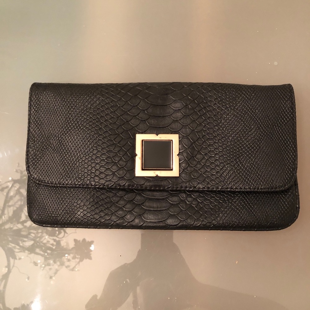 Black clutch with removable gold chain strap